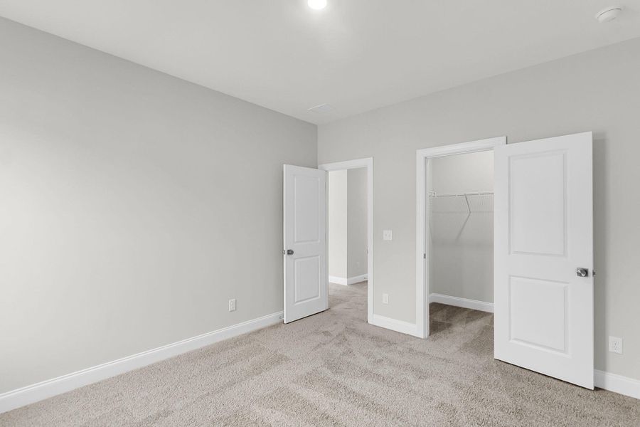 Spacious, unfurnished interior of a new home in Tidewater at Lakes of Cane Bay, Summerville (Image 36).