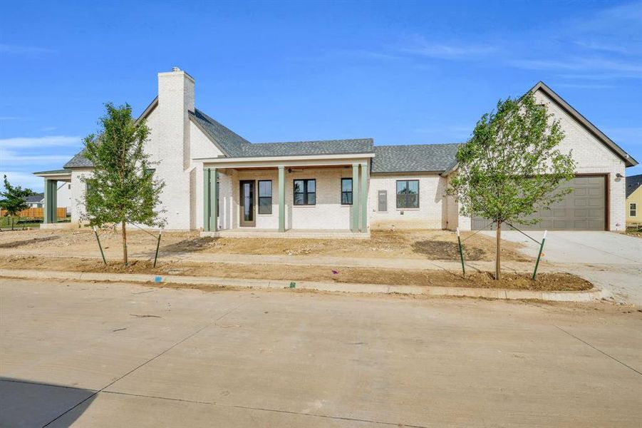 Front exterior of a new home in , Midlothian, TX, highlighting curb appeal (Image 16).