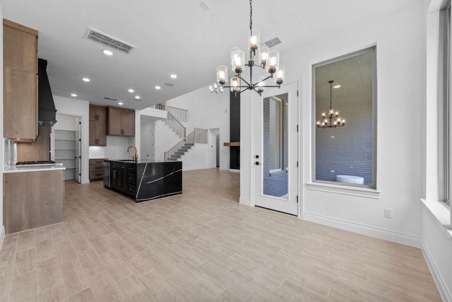 Spacious kitchen and dining area with open flow into the living room, perfect for entertaining.