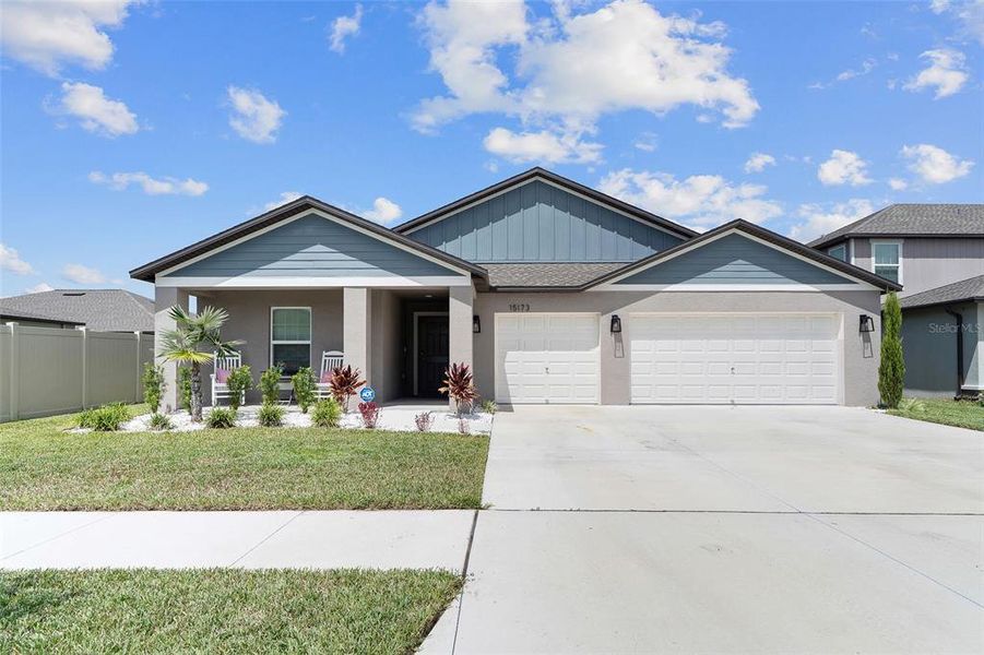 Front exterior of a new home in Balm Grove, Wimauma, FL, highlighting curb appeal (Image 24).