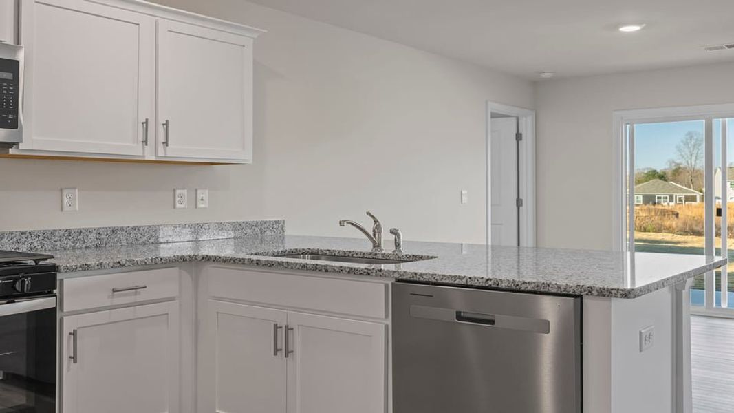 Furnished interior view inside a new home in Lakestone, Woodruff (Image 9).