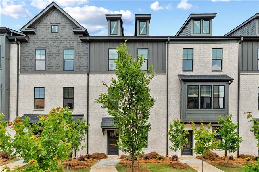 Front exterior of a new home in Silverock, McDonough, GA, highlighting curb appeal (Image 21).