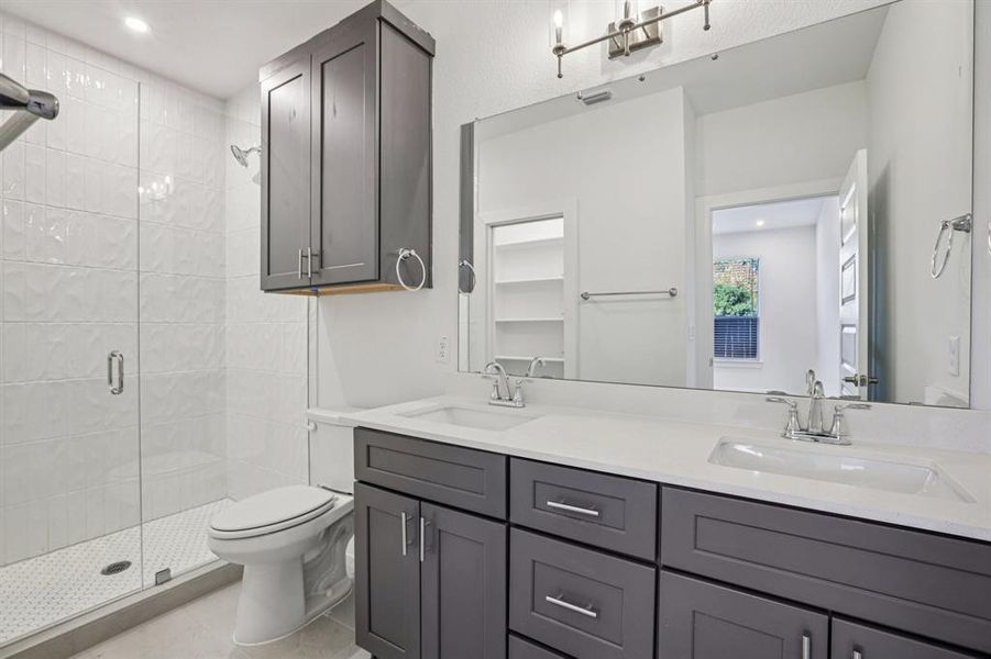 Fresh and bright, the primarybath features A dual quartzvanity and a walk-in shower withtextured subway tile for alittle extra style.(Sample photo offinishes and layout)