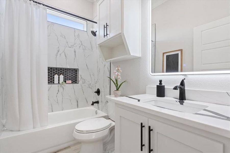 Guest bathroom with vanity and shower / tub combo Guest bathroom with vanity and shower / tub combo