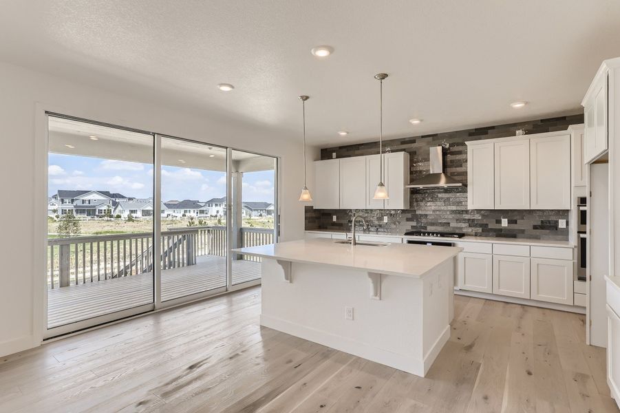 Kitchen in Cornell II plan at The Outlook at Southshore by Century Communities