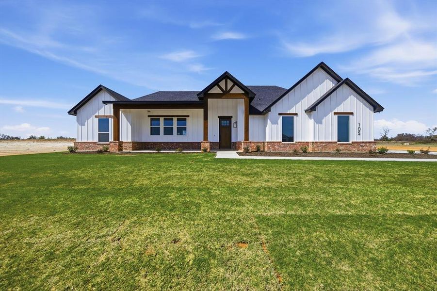 Front exterior of a new home in Zion Valley, Springtown, TX, highlighting curb appeal (Image 20).