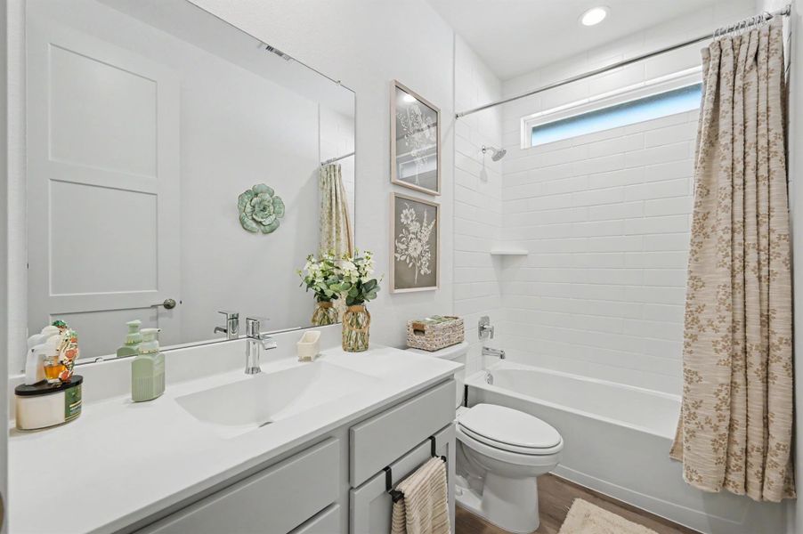 Full bathroom located between secondary bedrooms 2 and 3. Full bathroom located between secondary bedrooms 2 and 3.