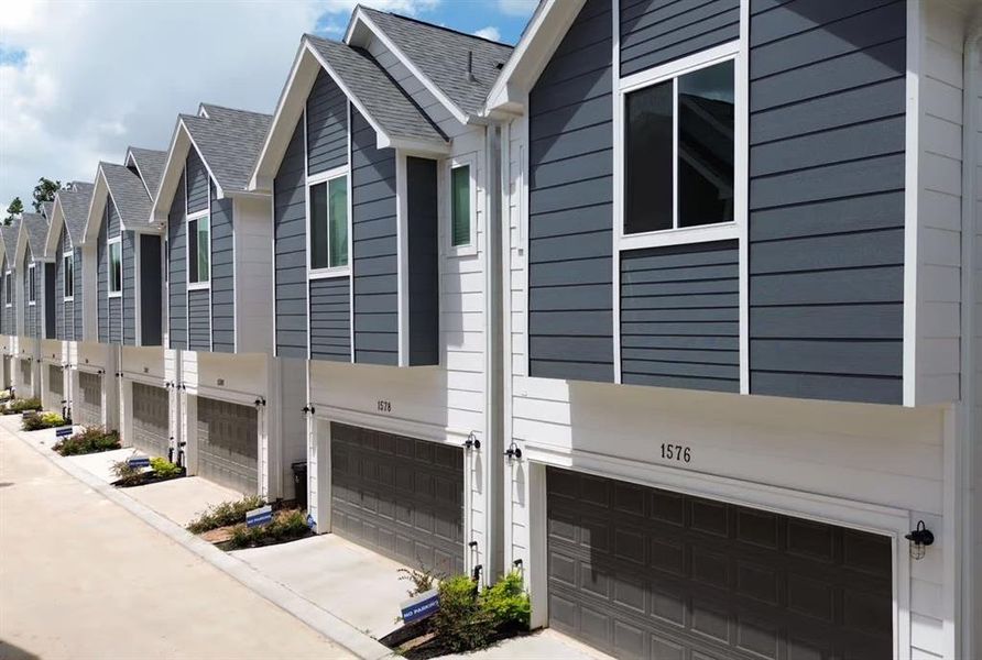 Access to the 2 car garage with shared driveway and gated entry