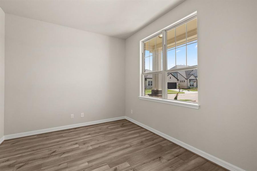 The home office features French doors, beautiful floors, large windows that give a fresh feel, this space promotes focus and creativity.