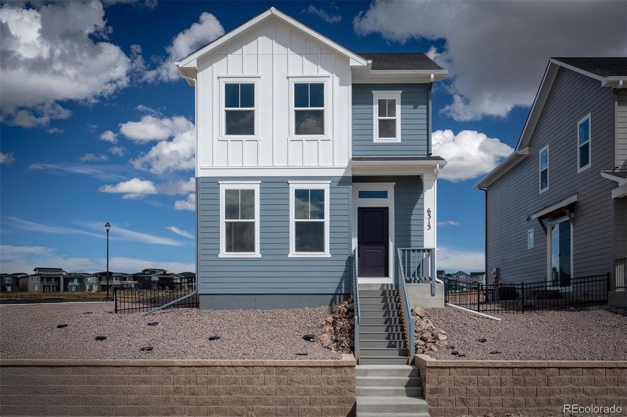 Exterior details and patio area of a home in Revel Crossing at Wolf Ranch – The Ascent Collection, Colorado Springs (Image 19).