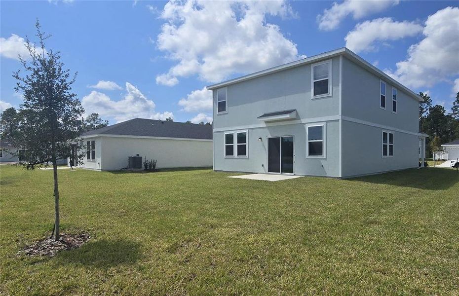 Exterior details and patio area of a home in Flagler Village - Classic Series, Palm Coast (Image 18).