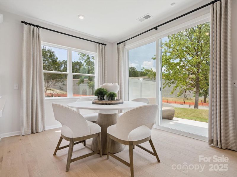 Dining Space Surrounded by Light Leading to Outdoor Living Dining Space Surrounded by Light Leading to Outdoor Living