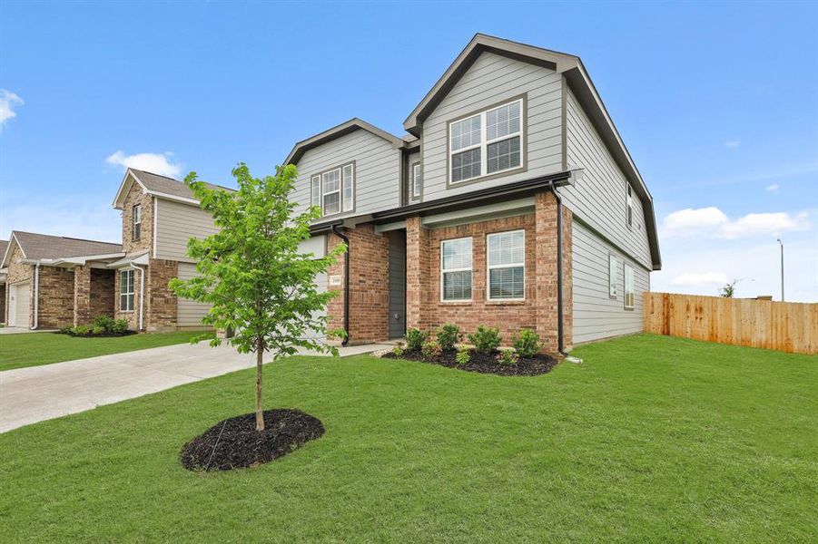 Front exterior of a new home in Retreat at Fossil Creek, Fort Worth, TX, highlighting curb appeal (Image 2). Front exterior of a new home in Retreat at Fossil Creek, Fort Worth, TX, highlighting curb appeal (Image 2).