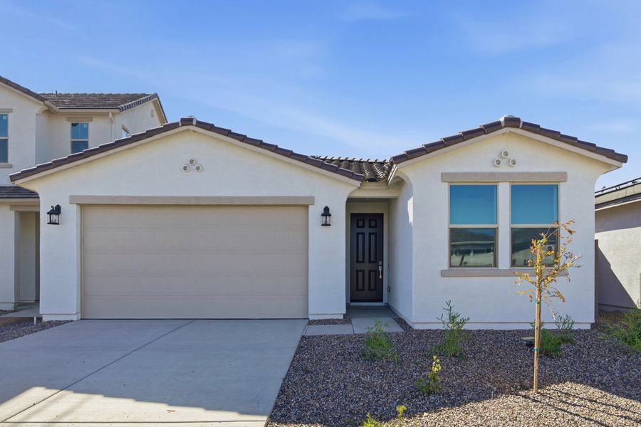 Front exterior of a new home in Willows at Bella Vista Farms, San Tan Valley, AZ, highlighting curb appeal (Image 1). Front exterior of a new home in Willows at Bella Vista Farms, San Tan Valley, AZ, highlighting curb appeal (Image 1).