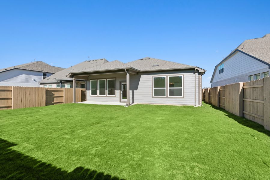 Exterior details and patio area of a home in The Colony, Bastrop (Image 4).