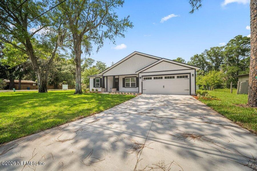 Front exterior of a new home in , Jacksonville, FL, highlighting curb appeal (Image 23).