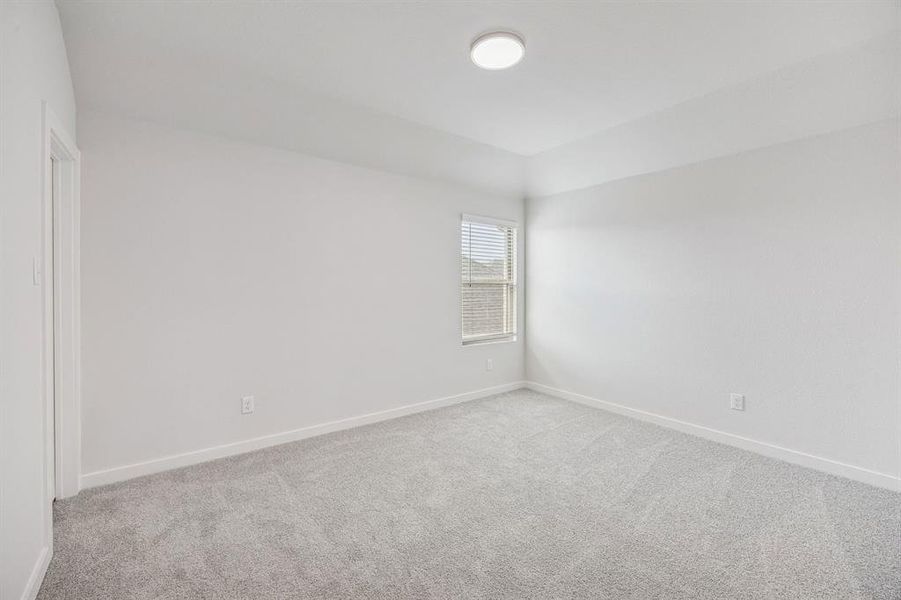 Bedroom in the Stanley II home plan by Trophy Signature Homes – REPRESENTATIVE PHOTO