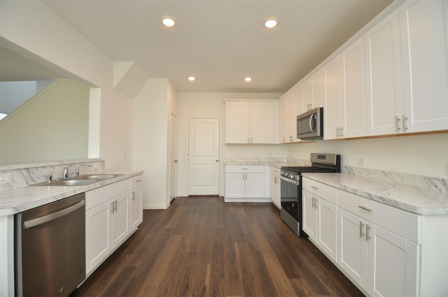 Spacious Kitchen area with modern appliances Spacious Kitchen area with modern appliances