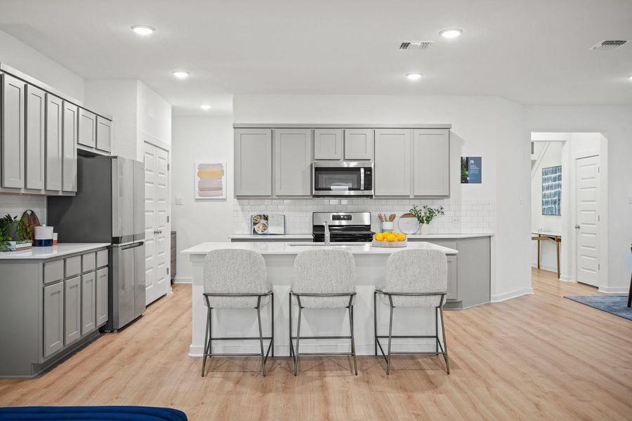Kitchen in the Oak home plan by Trophy Signature Homes – REPRESENTATIVE PHOTO