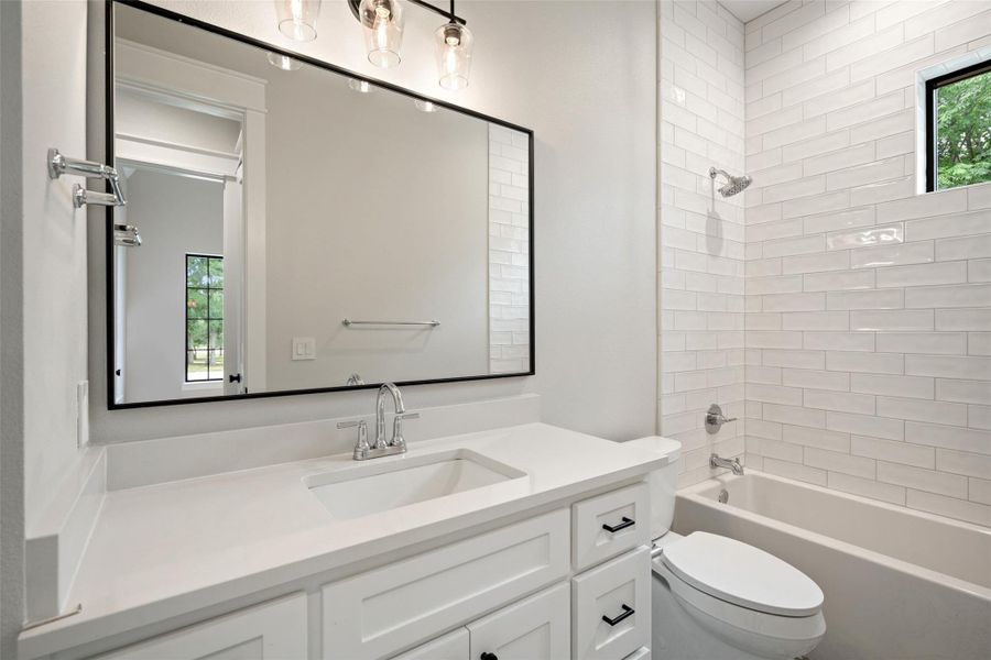 Modern white vanity with sleek black hardware offers a clean, contemporary bathroom aesthetic. Modern white vanity with sleek black hardware offers a clean, contemporary bathroom aesthetic.