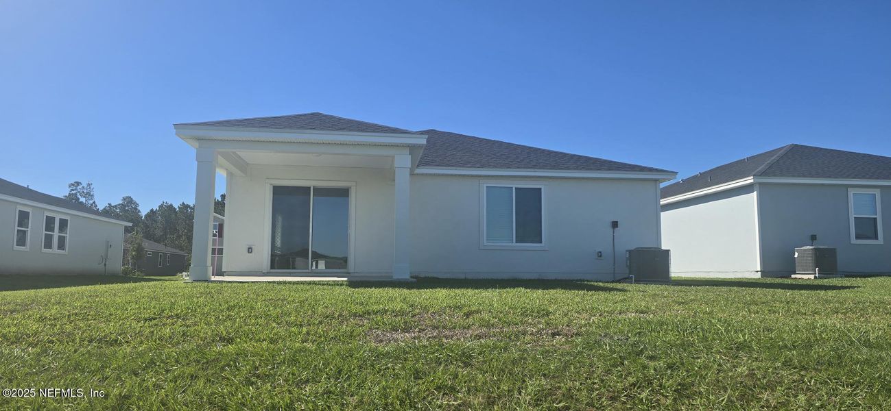 Exterior details and patio area of a home in Lakes at Bella Lago - Signature Series, Green Cove Springs (Image 20). Exterior details and patio area of a home in Lakes at Bella Lago - Signature Series, Green Cove Springs (Image 20).