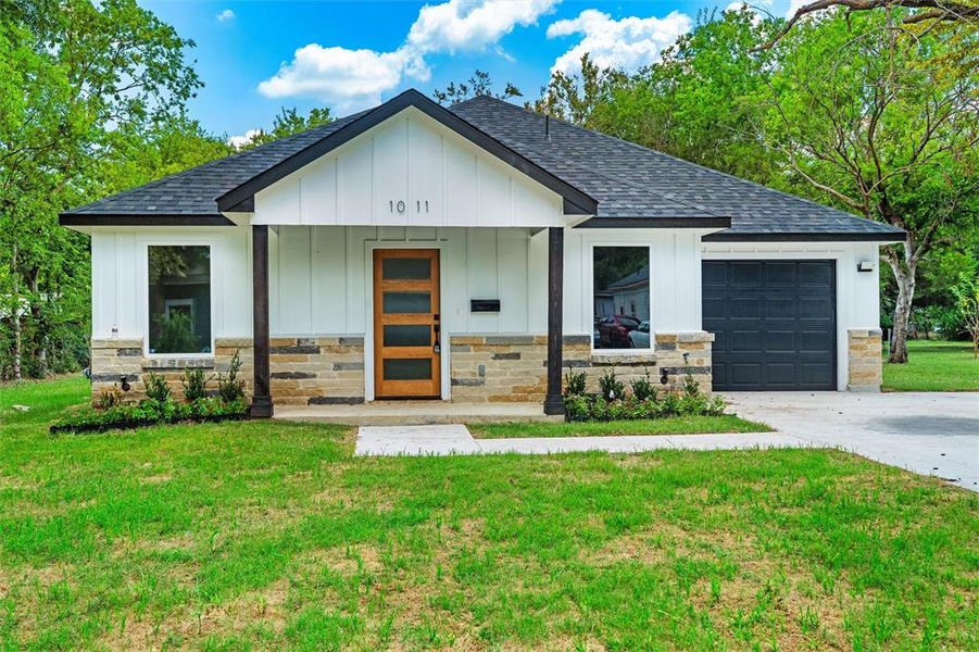 Front exterior of a new home in , Ennis, TX, highlighting curb appeal (Image 19). Front exterior of a new home in , Ennis, TX, highlighting curb appeal (Image 19).