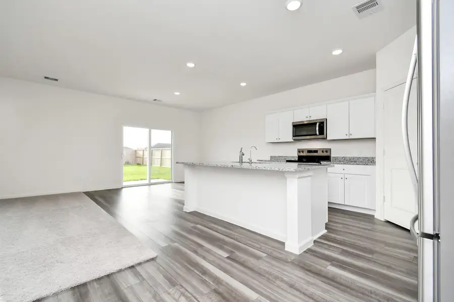 Furnished interior view inside a new home in Sunterra, Katy (Image 5).