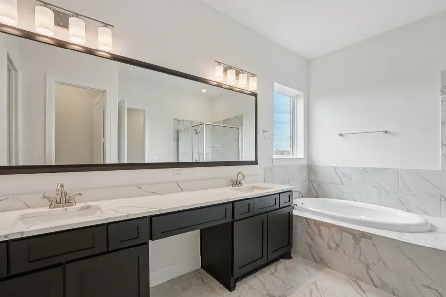 Furnished interior view inside a new home in Del Bello Lakes 60', Manvel (Image 10).