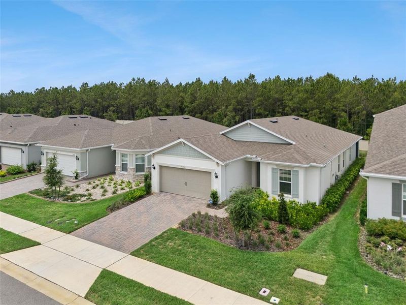 Front exterior of a new home in , Minneola, FL, highlighting curb appeal (Image 24). Front exterior of a new home in , Minneola, FL, highlighting curb appeal (Image 24).