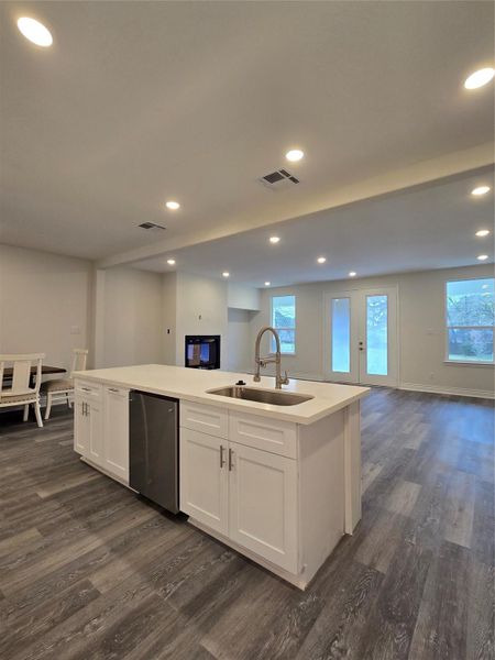 Kitchen toward the living room with fire place