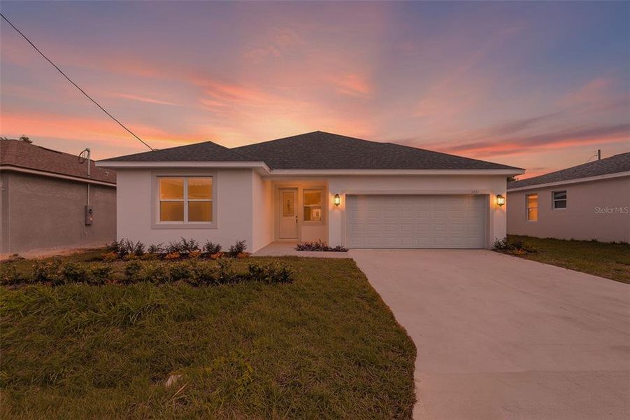 Front exterior of a new home in , Winter Haven, FL, highlighting curb appeal (Image 15).