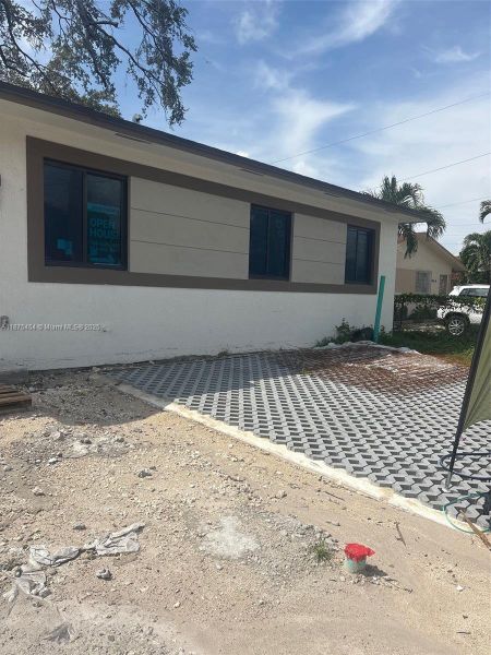 Front exterior of a new home in , Miami, FL, highlighting curb appeal (Image 17). Front exterior of a new home in , Miami, FL, highlighting curb appeal (Image 17).