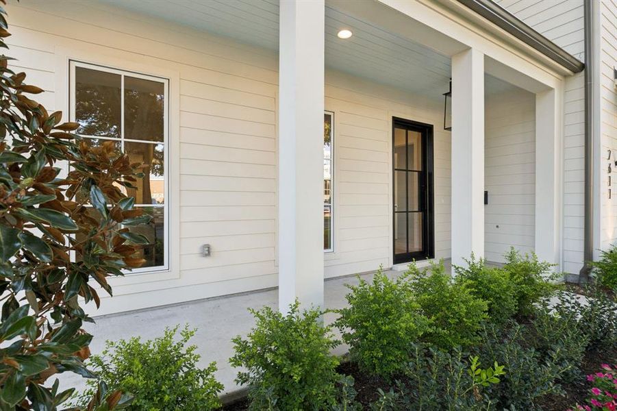 Property entrance featuring covered porch