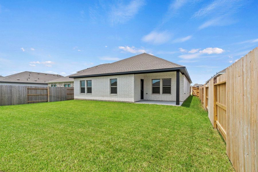 Exterior details and patio area of a home in Windrose Green, Angleton (Image 4).