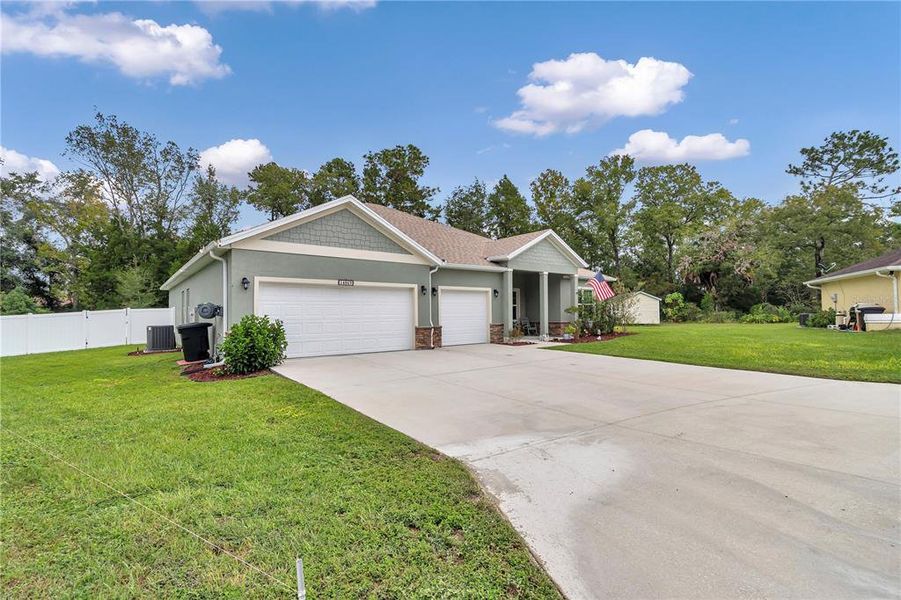 Front exterior of a new home in , Ocala, FL, highlighting curb appeal (Image 2). Front exterior of a new home in , Ocala, FL, highlighting curb appeal (Image 2).