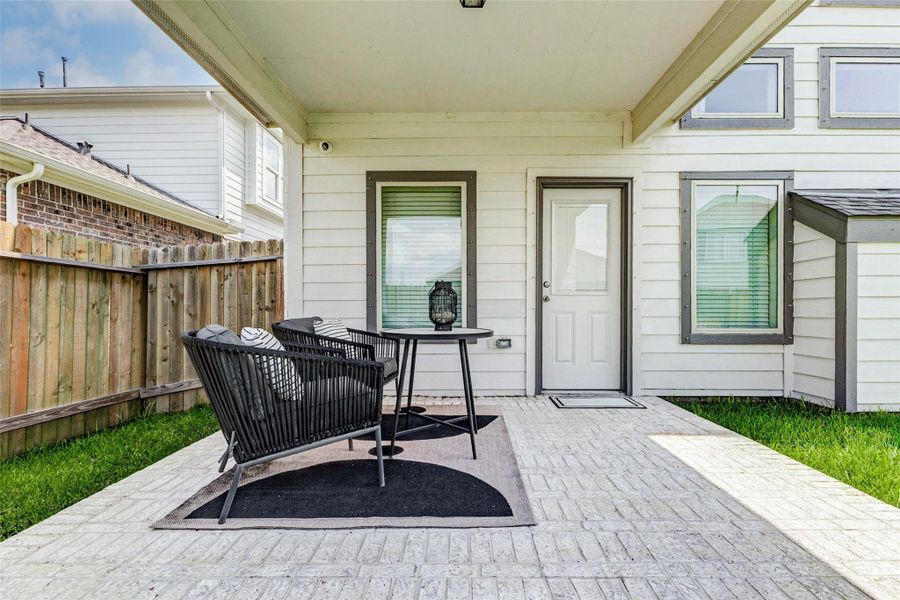 A covered patio and landscaped yard extend your living outdoors. A covered patio and landscaped yard extend your living outdoors.