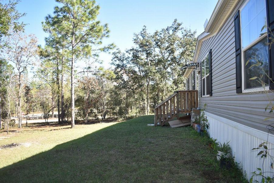 Exterior details and patio area of a home in , Williston (Image 38).