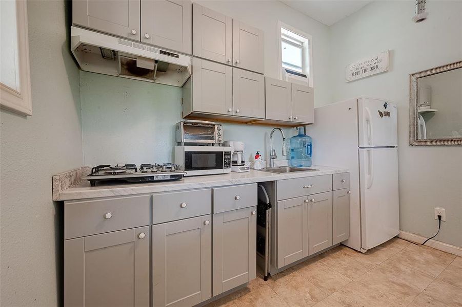 The room is filled with drawers and cabinets for storage.