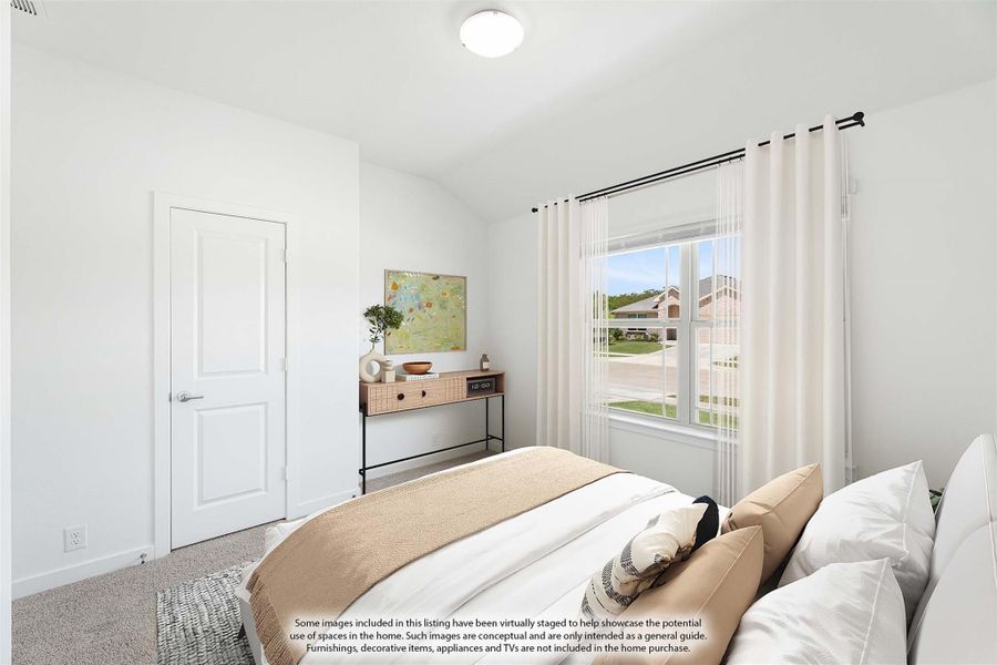 Bedroom with white walls, carpet flooring, large window with curtains, and a small dresser with wall art.
