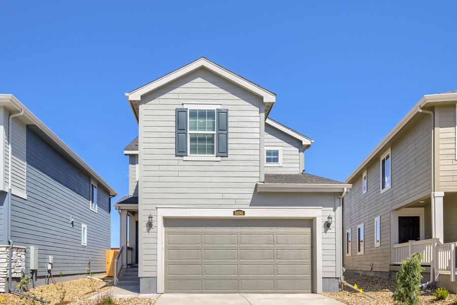 Front exterior of a new home in Copper Chase, Colorado Springs, CO, highlighting curb appeal (Image 1). Front exterior of a new home in Copper Chase, Colorado Springs, CO, highlighting curb appeal (Image 1).