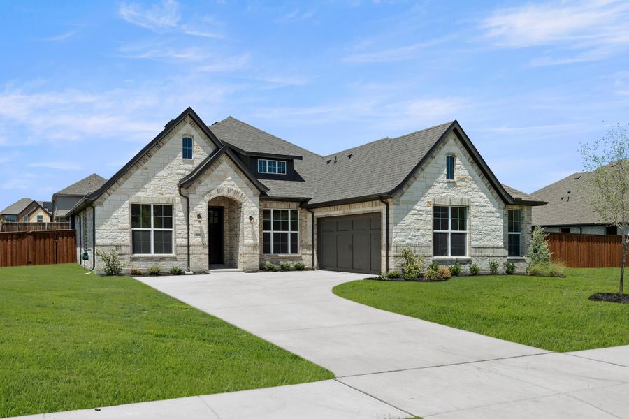 Front exterior of a new home in Lovers Landing, Forney, TX, highlighting curb appeal (Image 2). Front exterior of a new home in Lovers Landing, Forney, TX, highlighting curb appeal (Image 2).