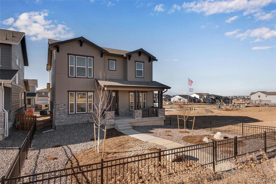 Exterior details and patio area of a home in Crescendo at The Aurora Highlands, Aurora (Image 4).