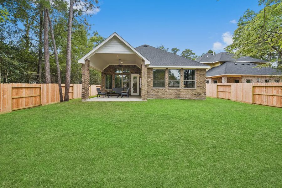 Exterior details and patio area of a home in The Woodlands Hills, Willis (Image 3).