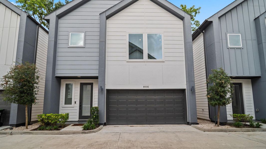 Front exterior of a new home in Highland Heights, Houston, TX, highlighting curb appeal (Image 18).