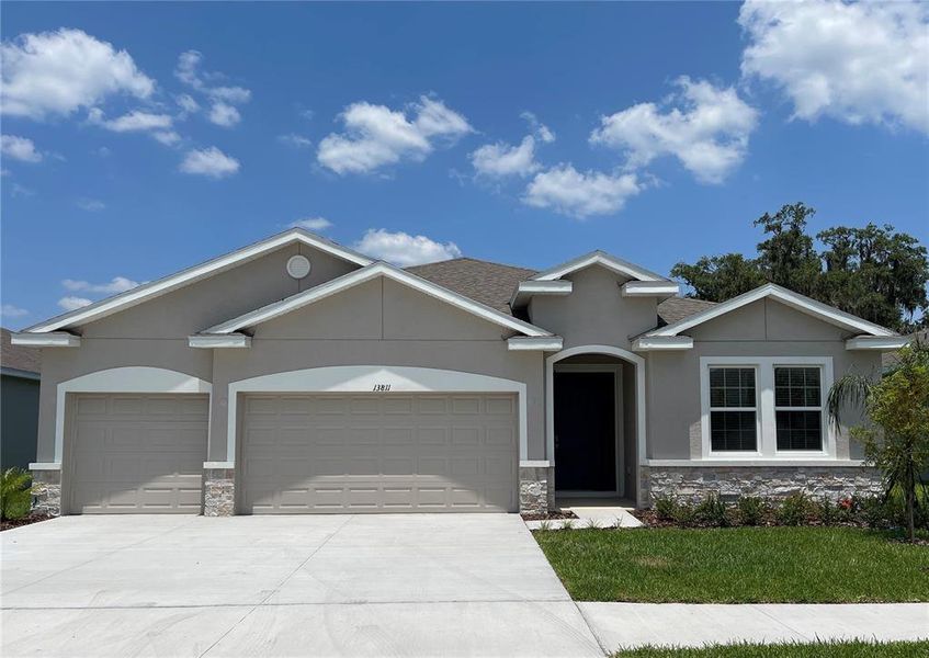 Front exterior of a new home in , Dade City, FL, highlighting curb appeal (Image 1).