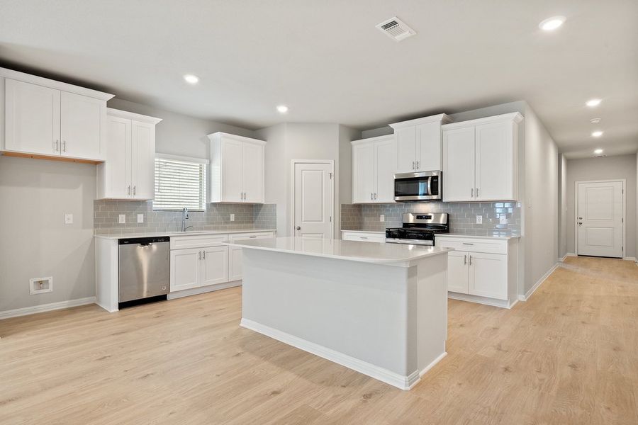 Furnished interior view inside a new home in Crosswinds, Kyle (Image 3).