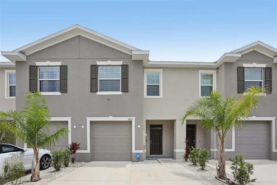 Front exterior of a new home in Easthaven, Tampa, FL, highlighting curb appeal (Image 1). Front exterior of a new home in Easthaven, Tampa, FL, highlighting curb appeal (Image 1).