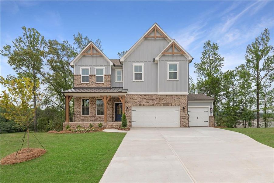 Front exterior of a new home in Tiberon Woods, Cumming, GA, highlighting curb appeal (Image 23).
