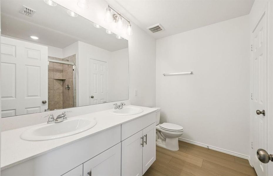 Elegant owner's bathroom with dual vanity Elegant owner's bathroom with dual vanity