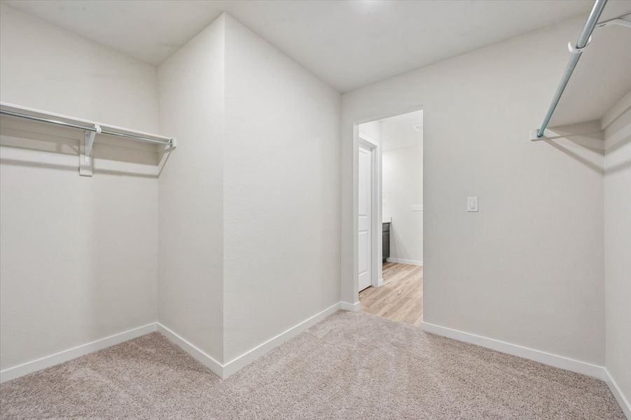 A hallway with white walls.